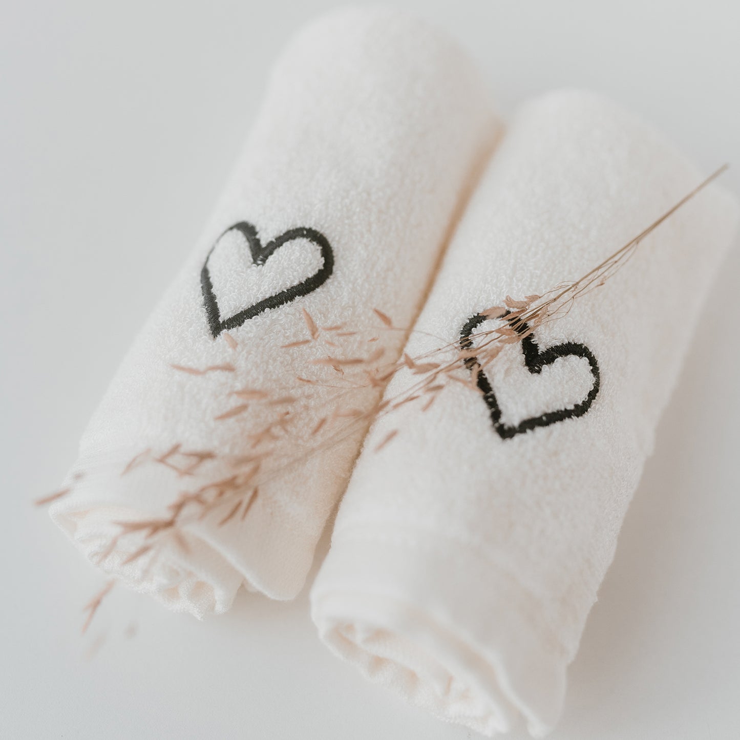 white washcloth with heart detail