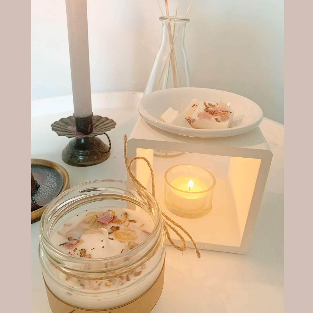 scented candle with dry flowers