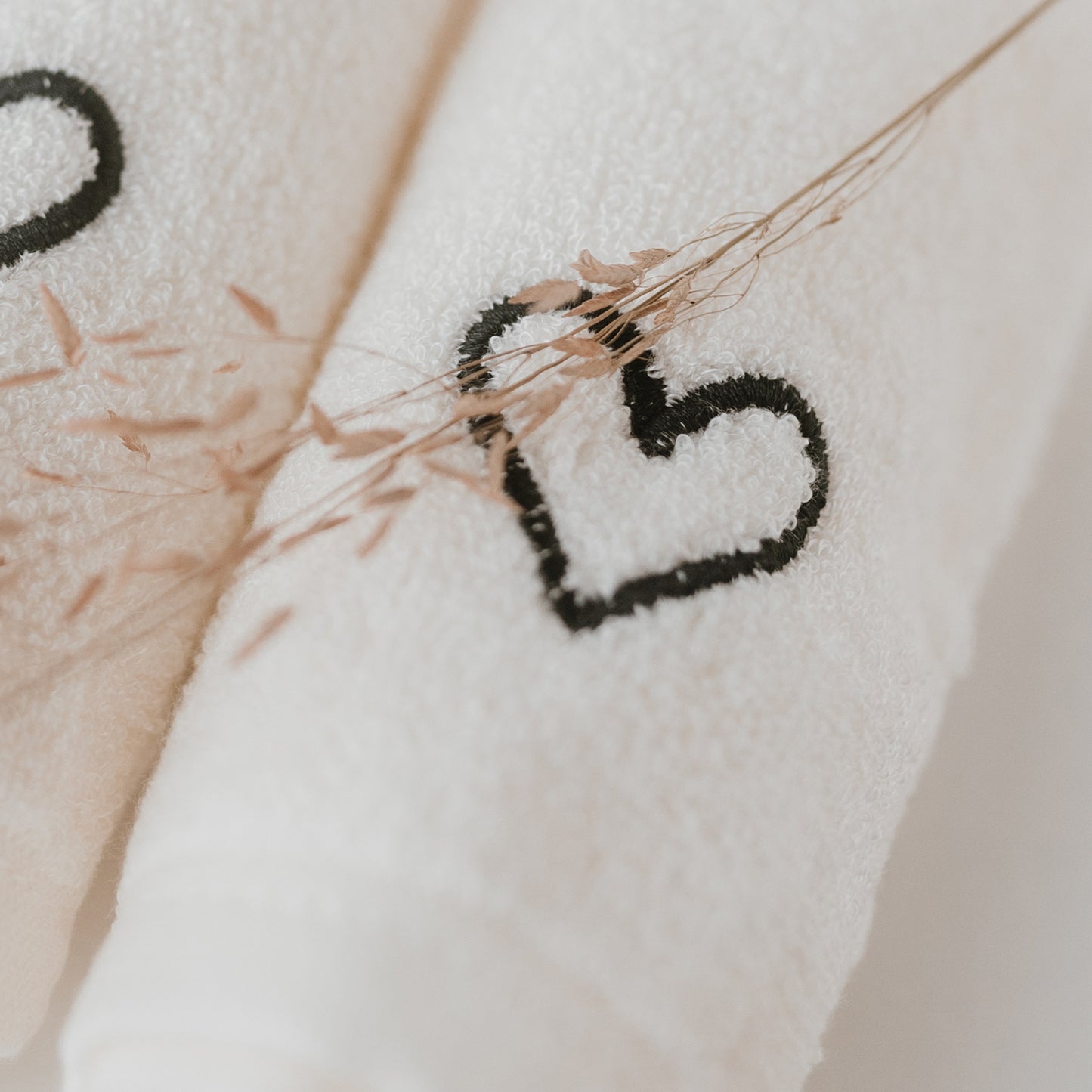 white washcloth with heart detail